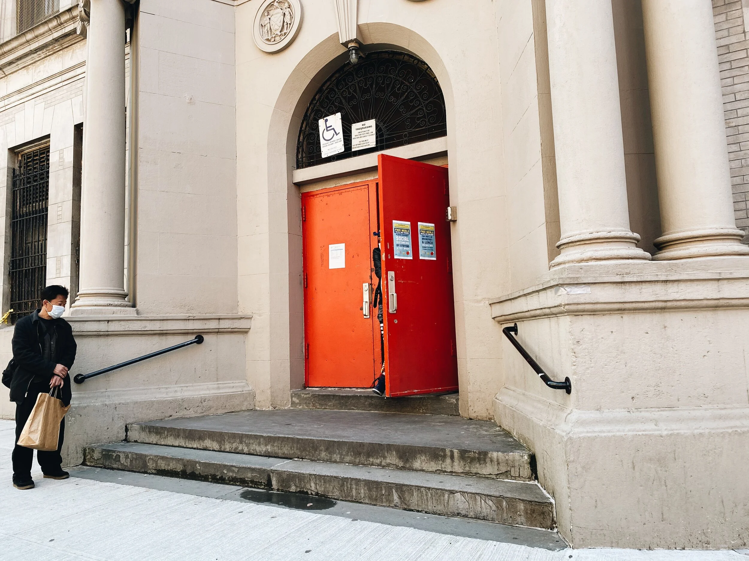 Social distancing outside of a Department of Education “meal hub” at P.S. 1 Alfred E. Smith School in Chinatown, Manhattan. Anyone in need of food, regardless of employment or immigration status, can text “NYC FOOD” or “NYC COMIDA” to 877-877 to fin…