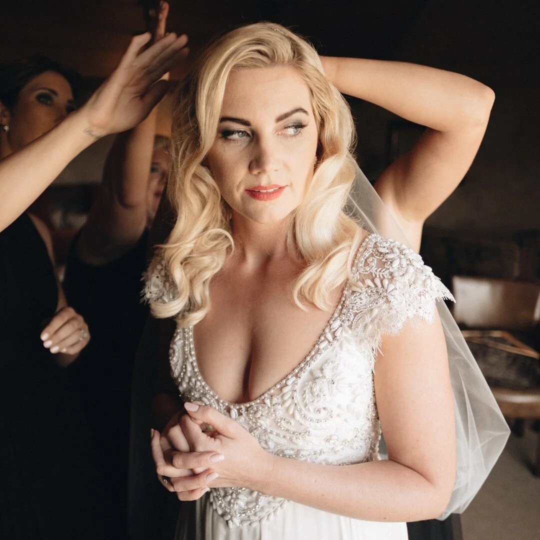 This photo makes me wonder what this beauty of a bride was thinking. Her hands seem to be entwined together and her gaze is soft and thoughtful.

I hope that whenever Tori looks back on this photo it brings a smile to her face as she remembers what s
