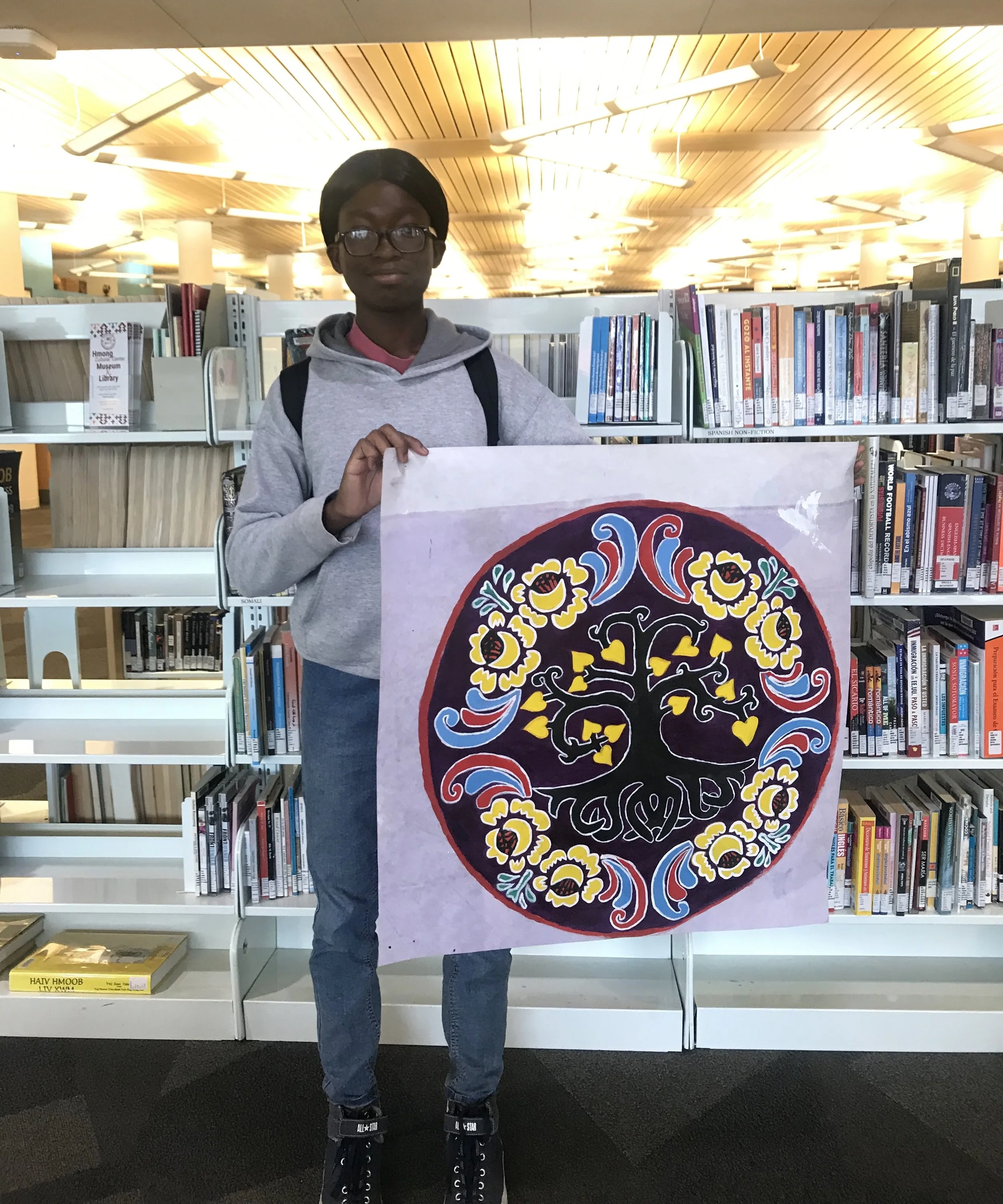 Youth intern with community designs