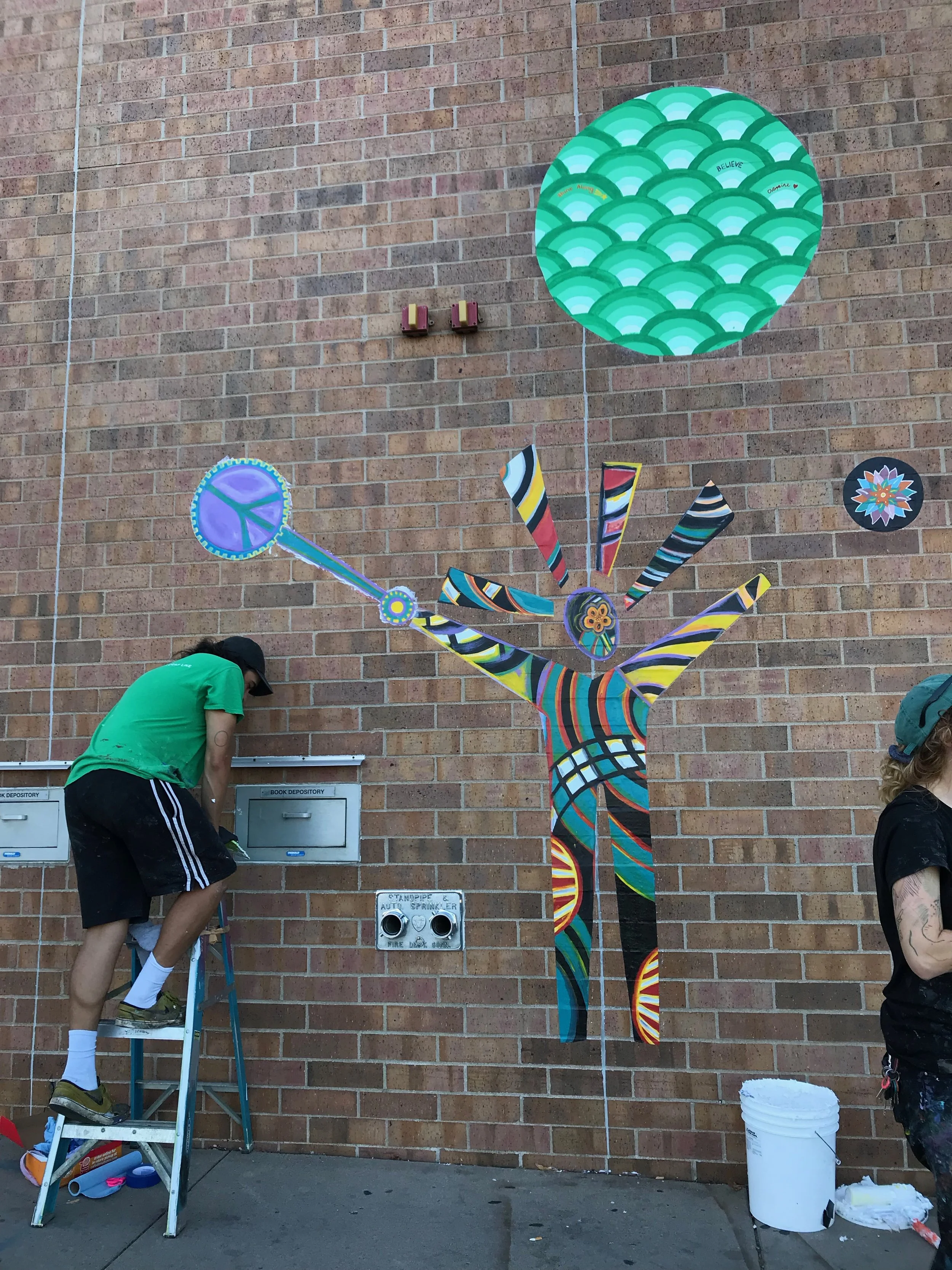 Peace bubble maker mural installation