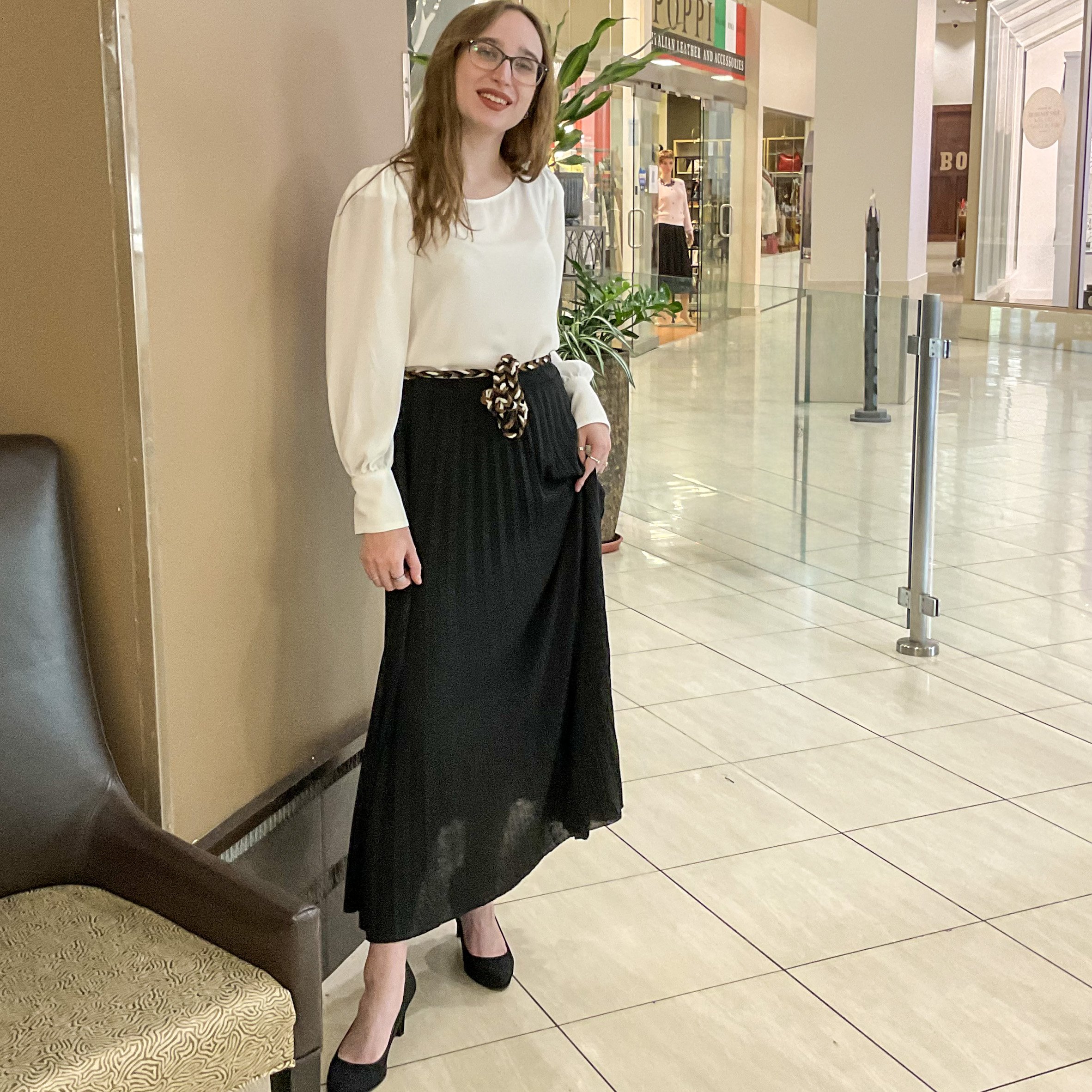 Stylish Spring Outfit: Black Pleated Maxi Skirt and Distressed Denim Jacket