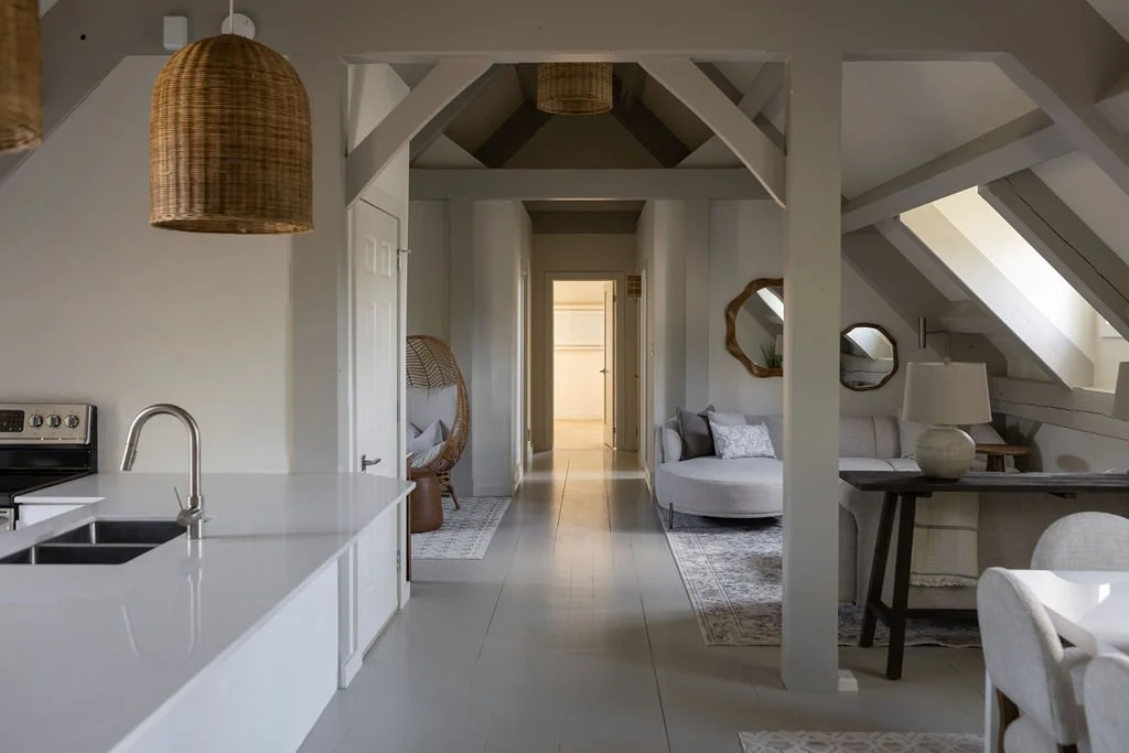 Wide shot of kitchen, dining room, and living room