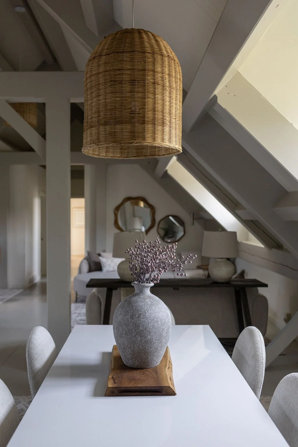 Open concept dinning and living area with beautifully designed furniture and decor