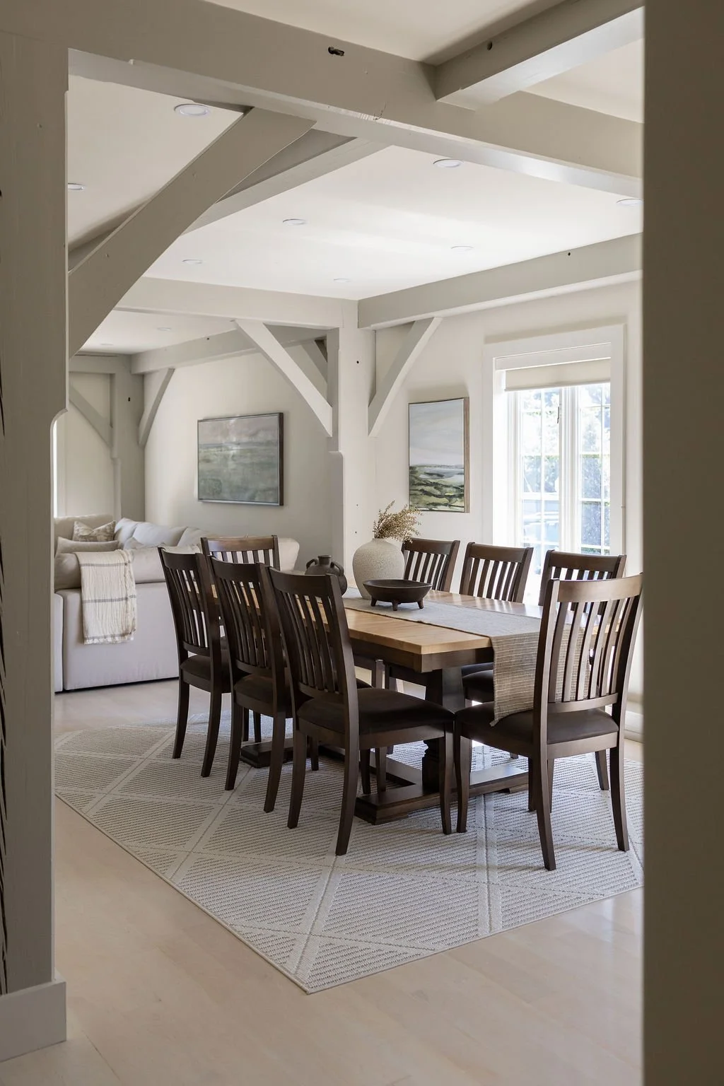 Wood beamed open concept dinning living room on the ground floor of the private Elora hotel