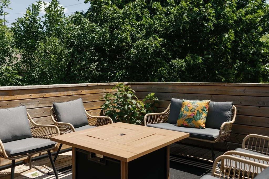 roof top terrace with sofa, chairs, and gas fire pit