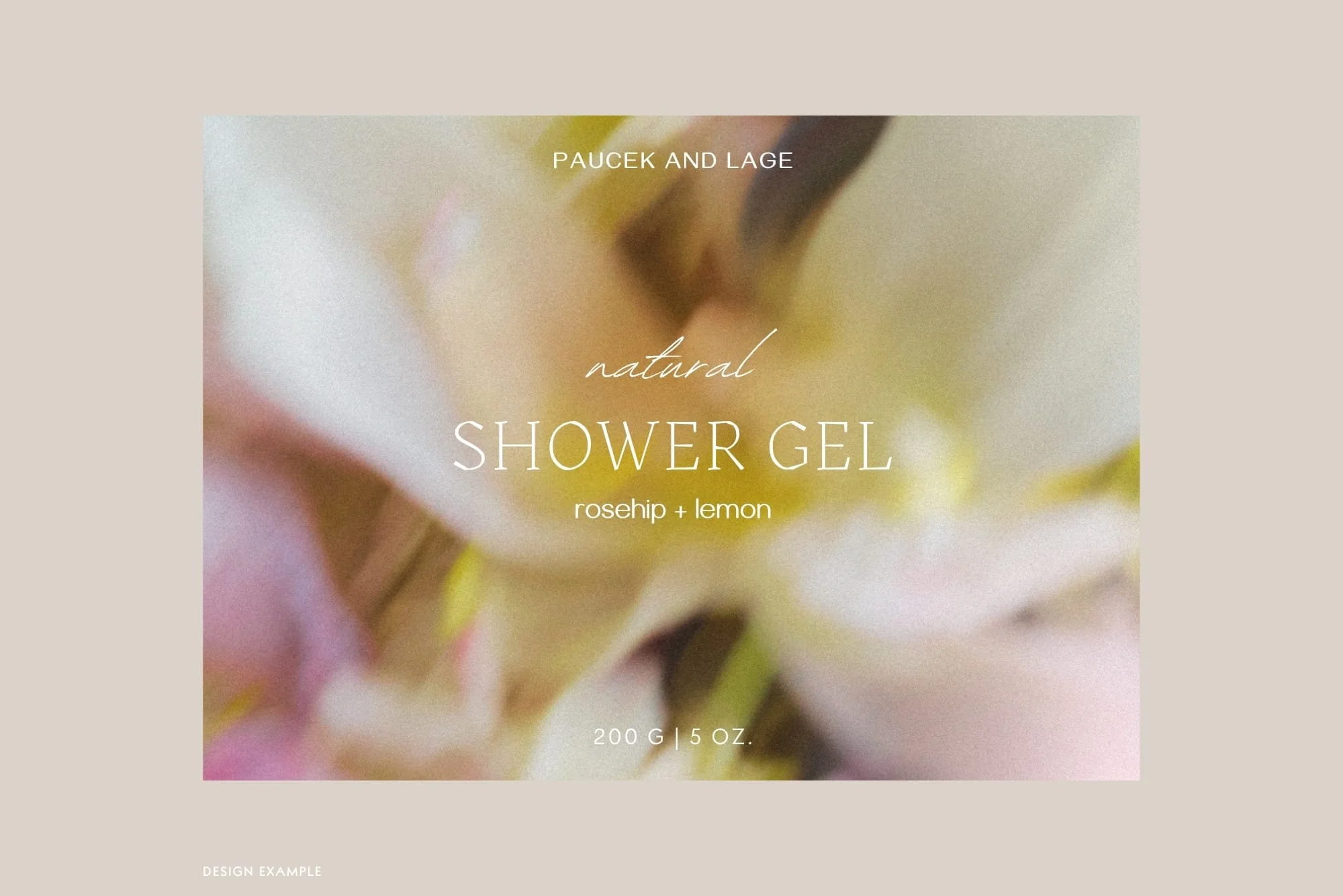 Cosmetics packaging label mockup for Natural Shower Gel featuring a soft yellow and blush blurred floral background texture, tailored for luxury skincare and organic beauty brands.