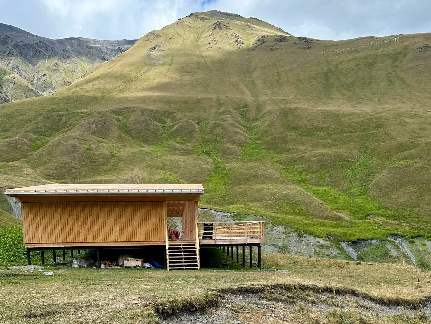 mountain hut under construction in georgia side view
