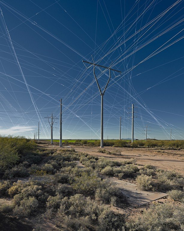  A web-like pattern streaks through the desert sky. 