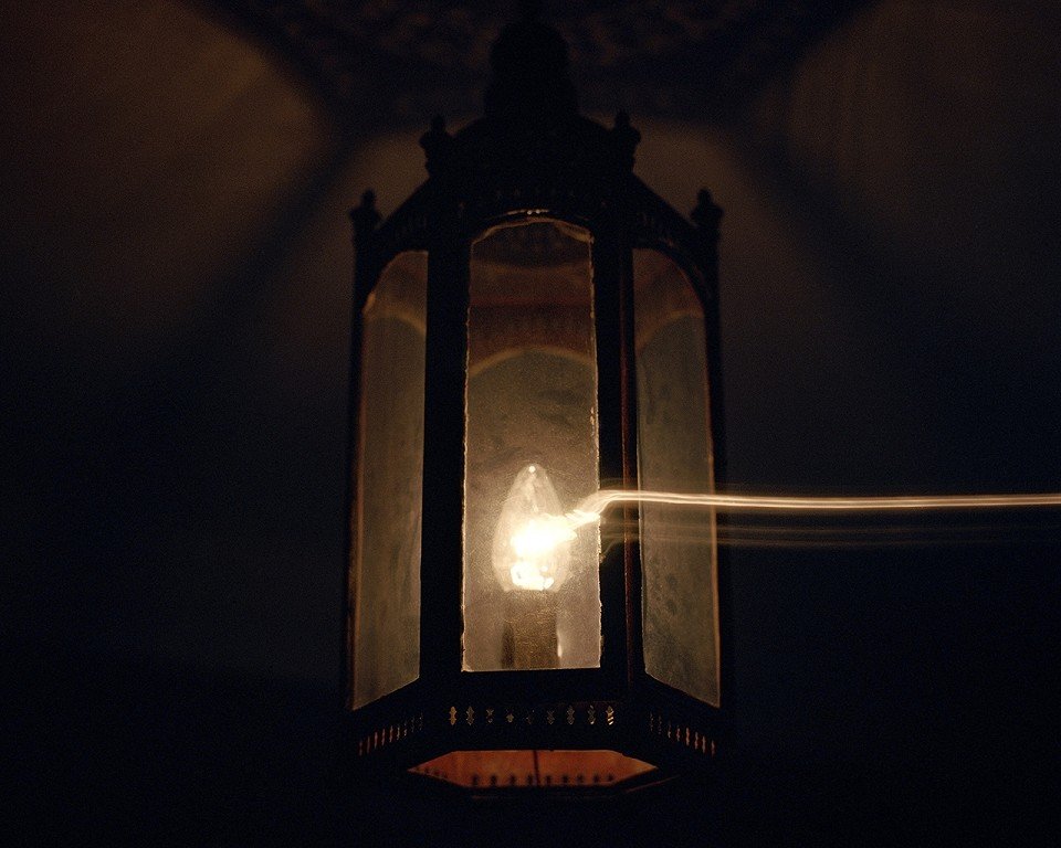  Close up of a lit porch light. 