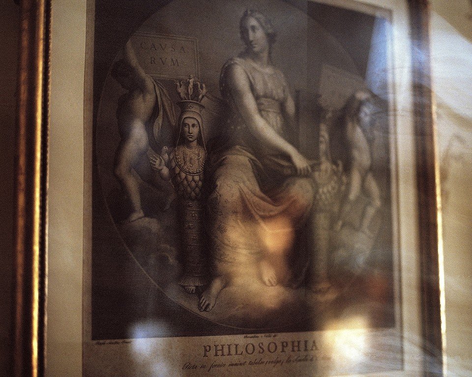  A framed painting with the words, “philosophia.” 
