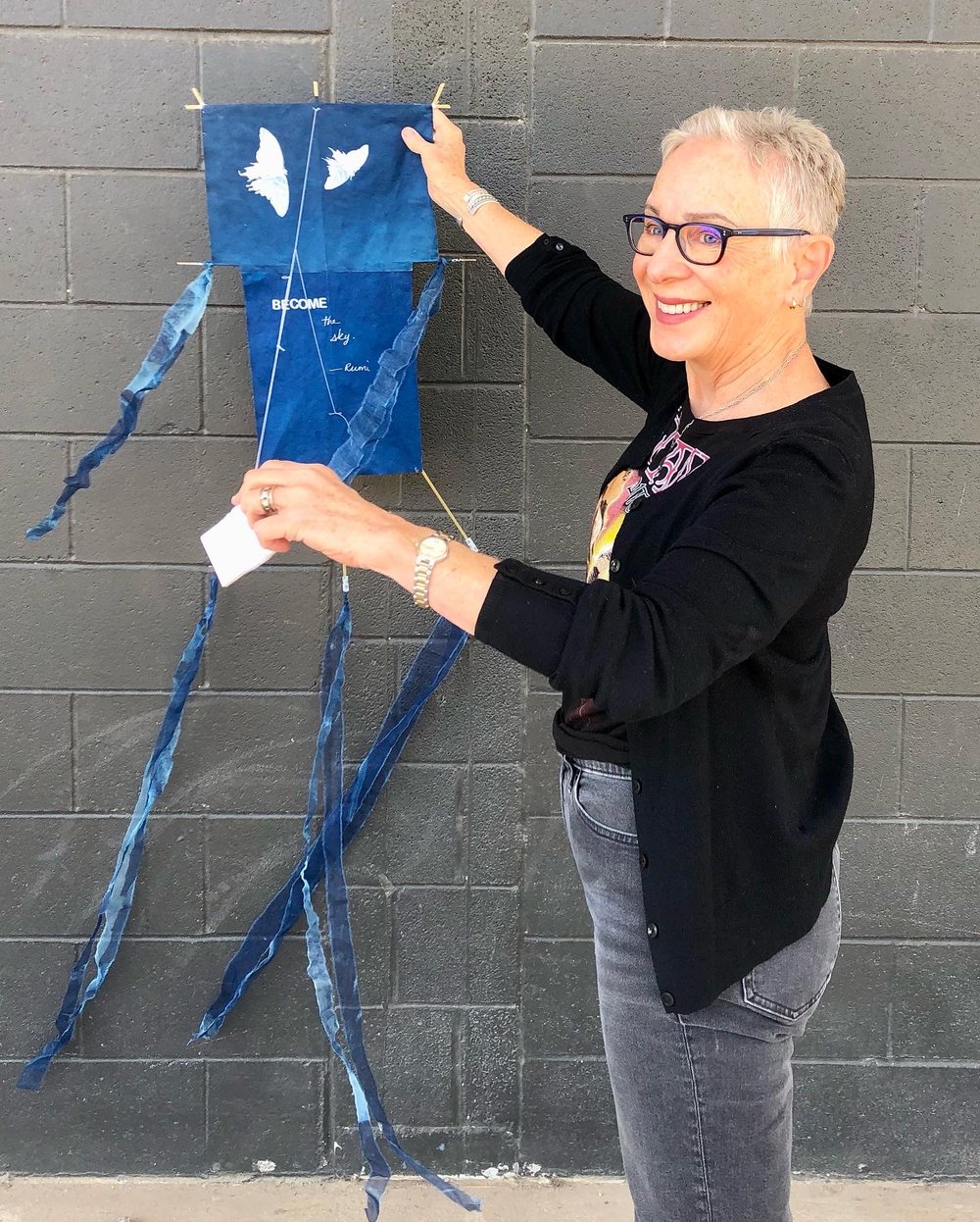  Woman shows off her cyanotype kite. 