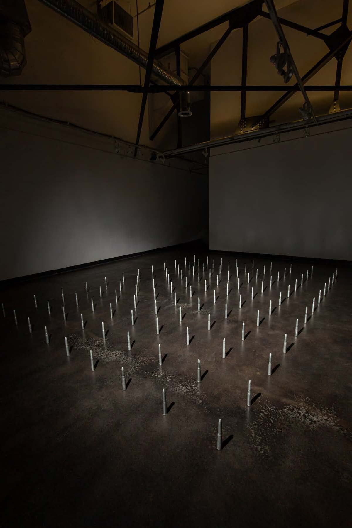  Installation shot of a room full of 20mm anti-aricraft bullets. 