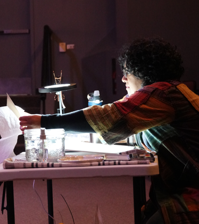 Artist Ameila Hills creates an original artwork live during Sounds Like Alberta.