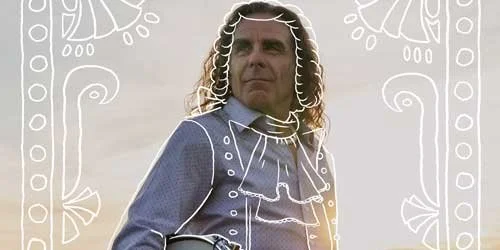 A person with long curly hair wearing a buttoned shirt stands in a grassy field at sunset holding a drum and drumsticks with white decorative line art overlaying the figure.