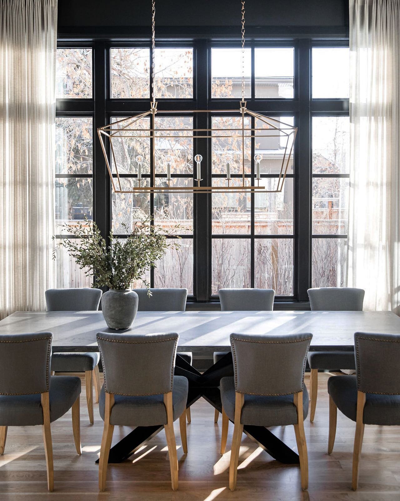 A straight-on shot of this dining space that has the most beautiful light coming through those glorious black stained windows. 
.
.
.
.
.
.
#diningroom #diningroomdecor #blackwindows #interiordesign #homeinterior #dreamhome #hillhurstcustom3