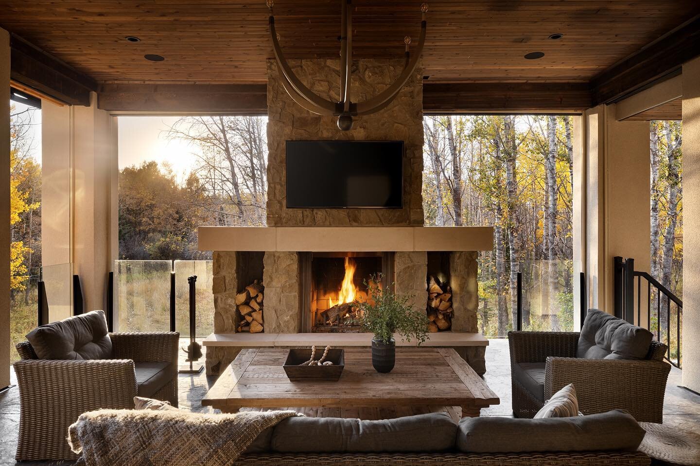 While we may be surrounded by the white stuff now, this outdoor space still gets plenty of use. Once we drop the powered screens, turn on the soffit heaters, and get a big old fire going, our outdoor space becomes the perfect cozy addition. 
.
.
.
.
