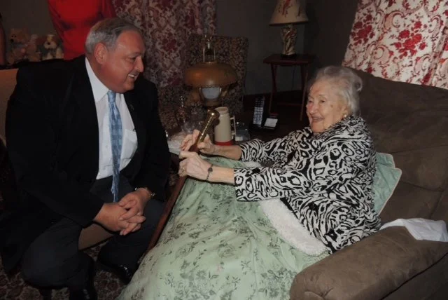 Evelyn being presented with cane.jpg