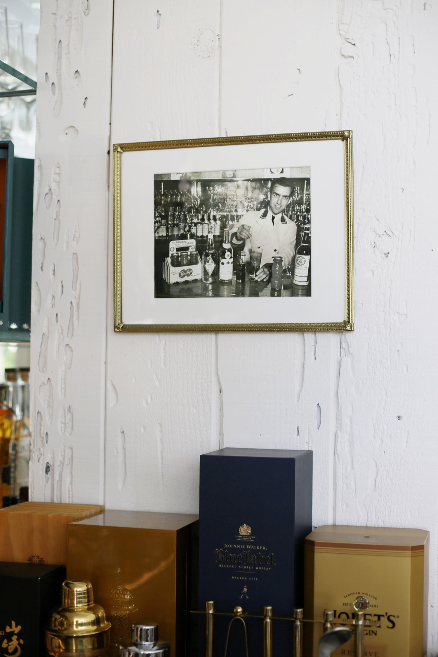  Original photography of Lloyd Vance, grandfather of Jeff Vance, bartending at a bar in Hollywood in the 1940s hanging up in original bar by Jeff Vance. 