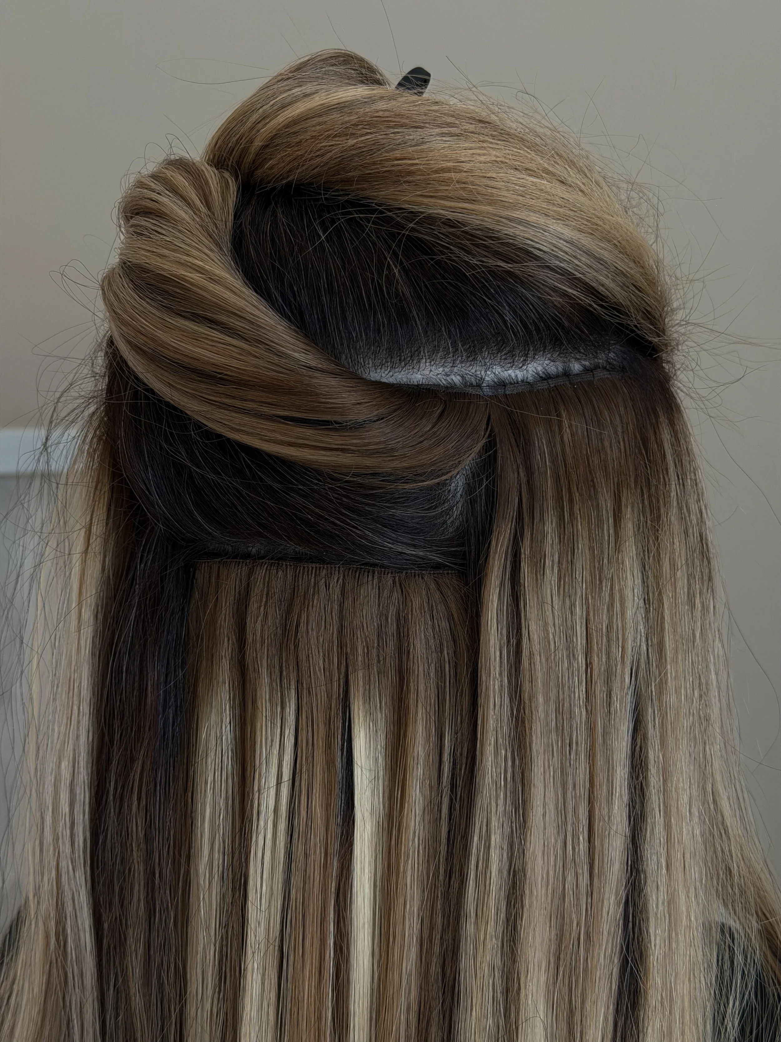Extensions are an investment and proper maintenance is what keeps them looking flawless 

Move ups every 4-6 weeks are essential to maintain a seamless blend, protect the integrity of your natural hair, and keep your extensions feeling light + comfor