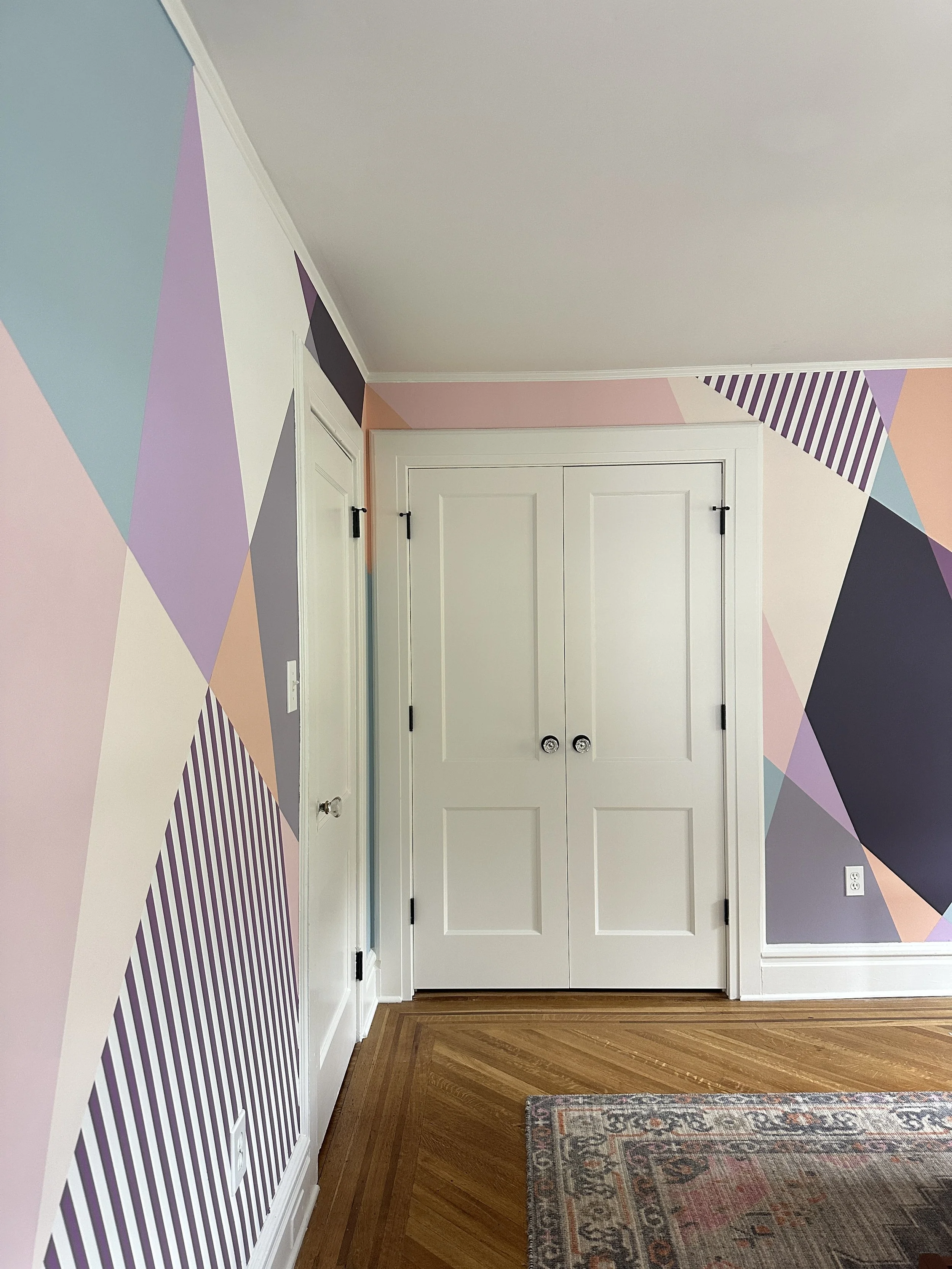 Custom teen bedroom mural by Shapes For The People, painted as a wraparound design for a cozy and personal retreat.
