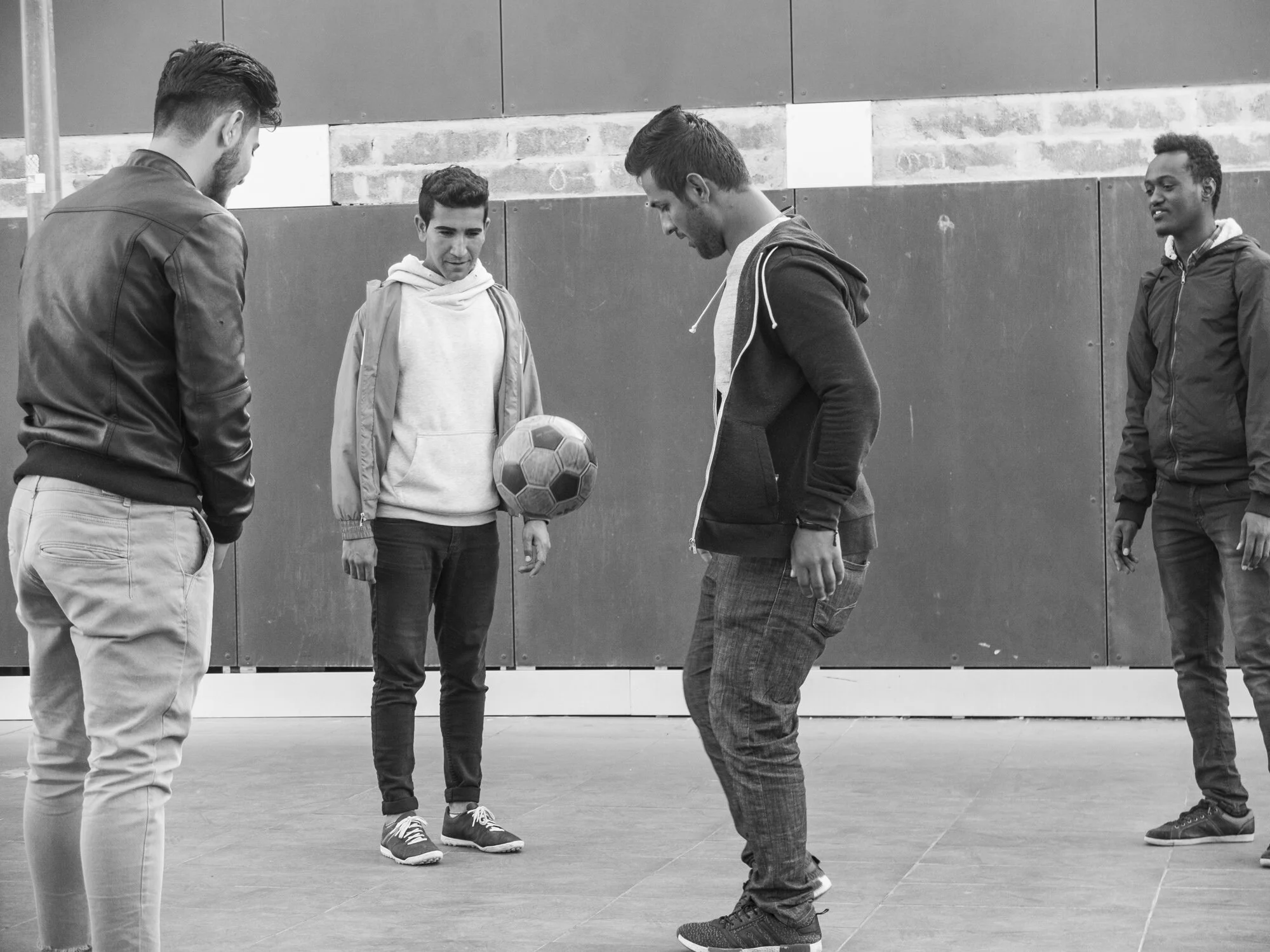   Passing Time   Men play soccer to pass the time as they wait for responses on their commission to learn if they will be accepted as legal refugees in Rome. 