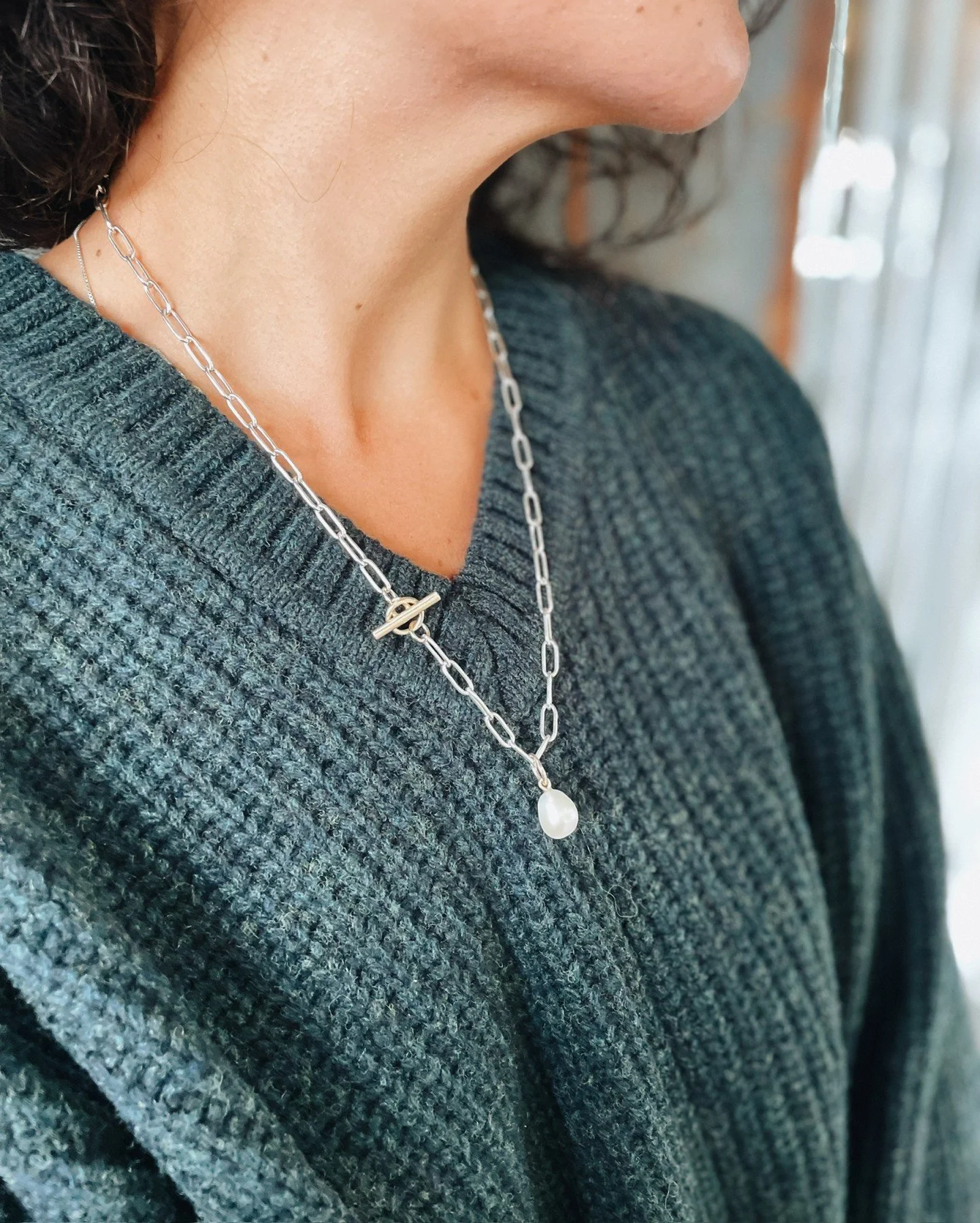 Hand formed necklace with toggle clasp &amp; pearl from @mollydebiak 💫 with Angled Rib V-Neck from @6397_news. 

1 week until @6397_news joins us in store with pieces from their Fall/Winter collection! Mark your calendars 🤗