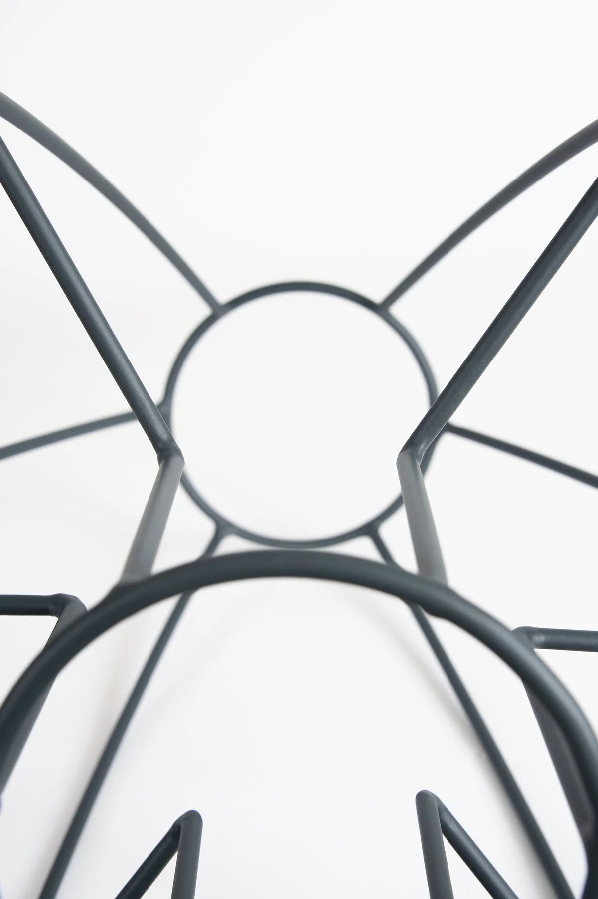 close up photograph of minimalist gray metal sculpture