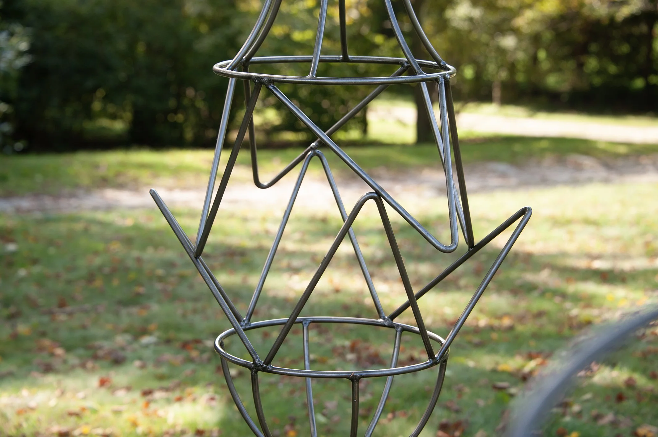 close up on outdoor metal sculpture made of steel rod