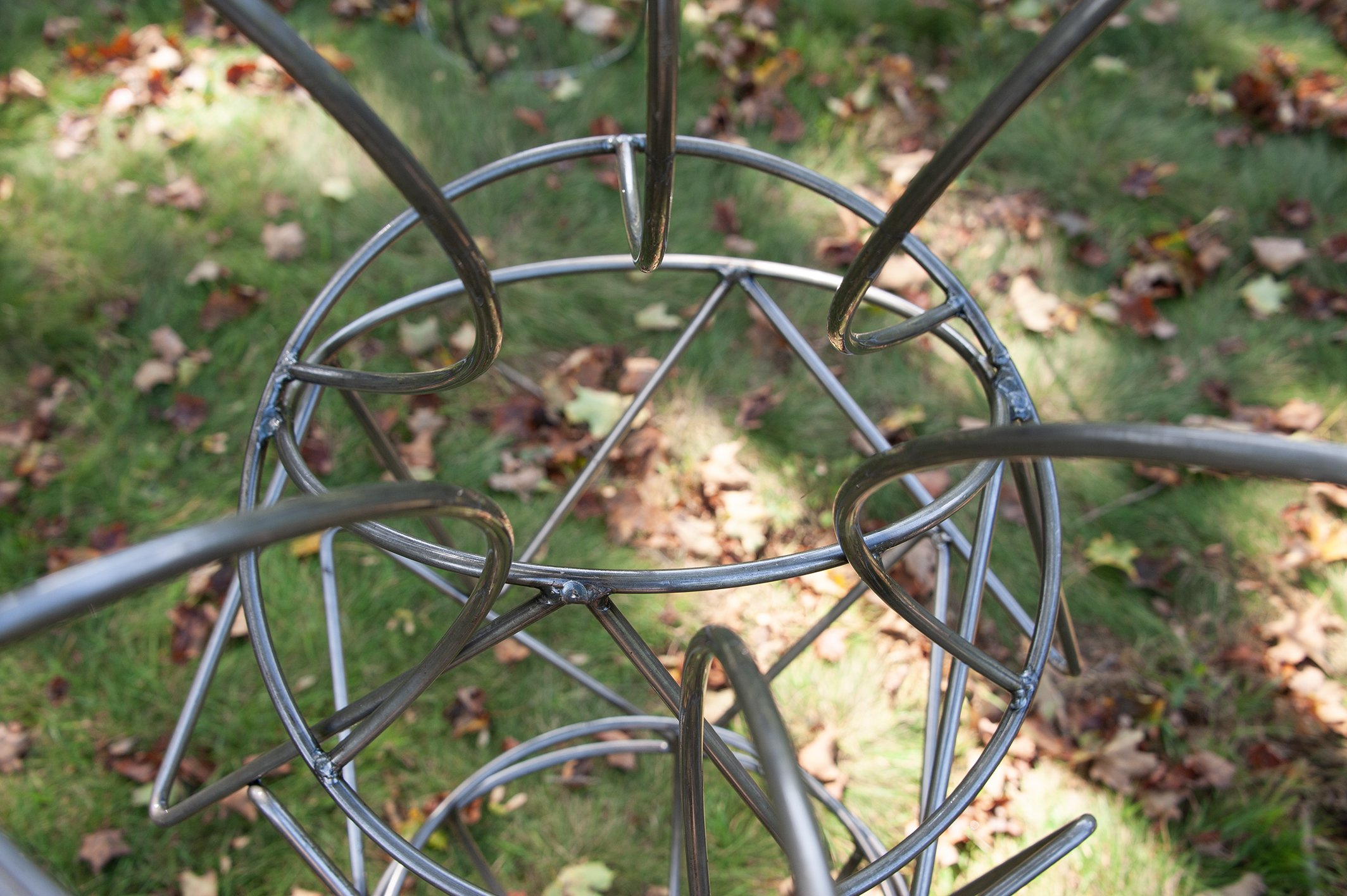 close up on outdoor metal sculpture made of steel rod
