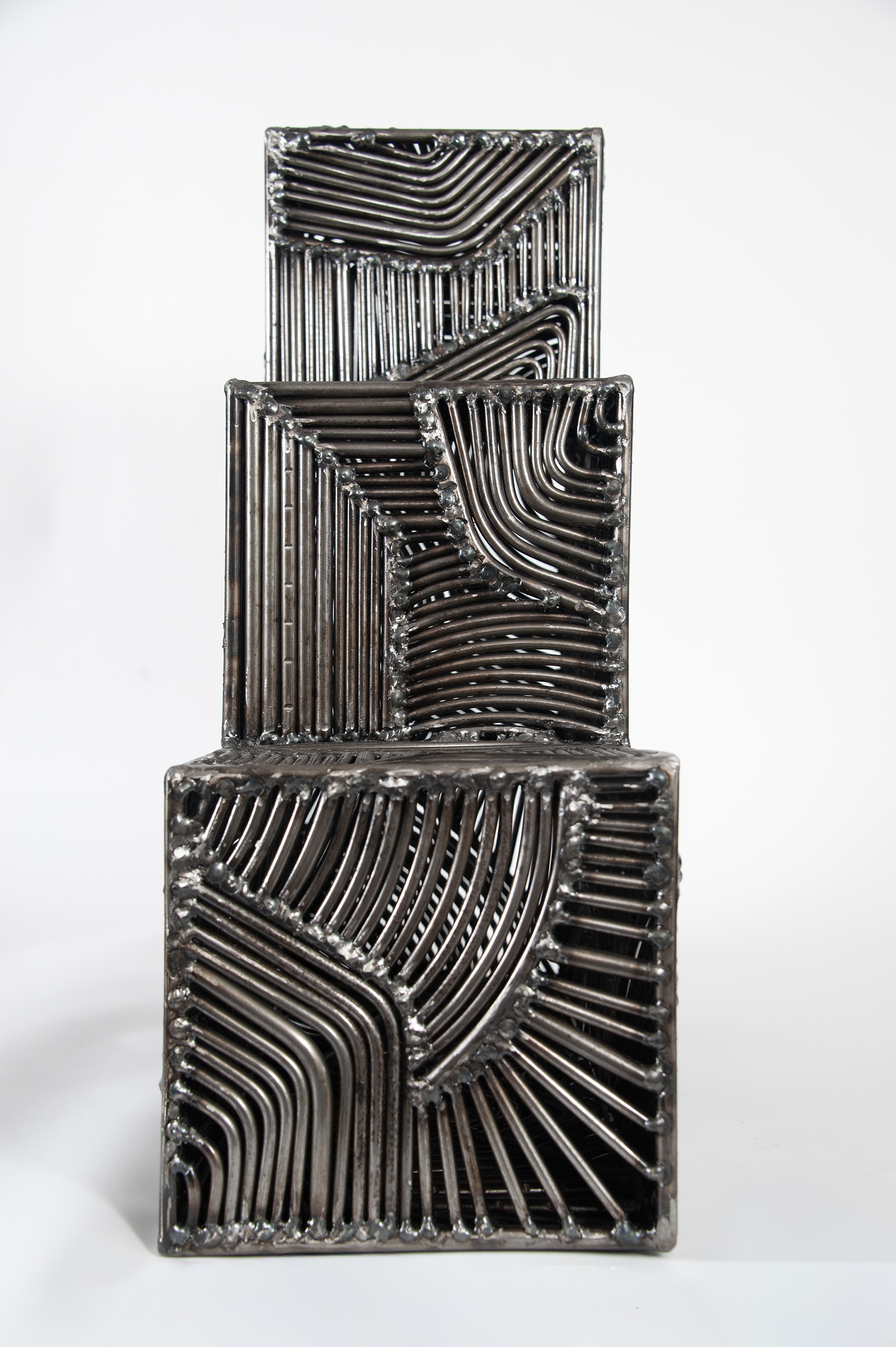 Large scale indoor metal sculpture. Intricate, abstract fine art object.