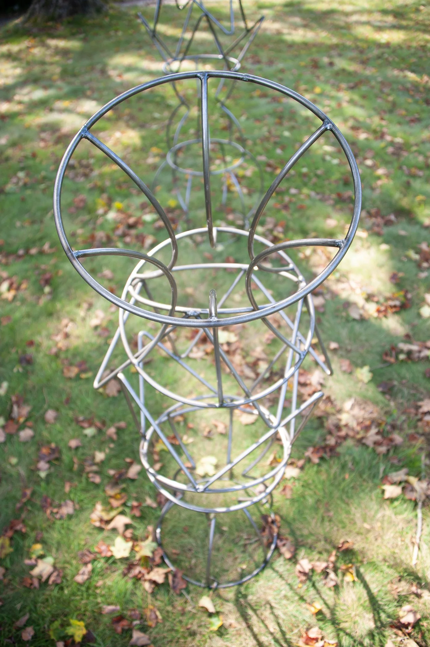 close up on outdoor metal sculpture made of steel rod