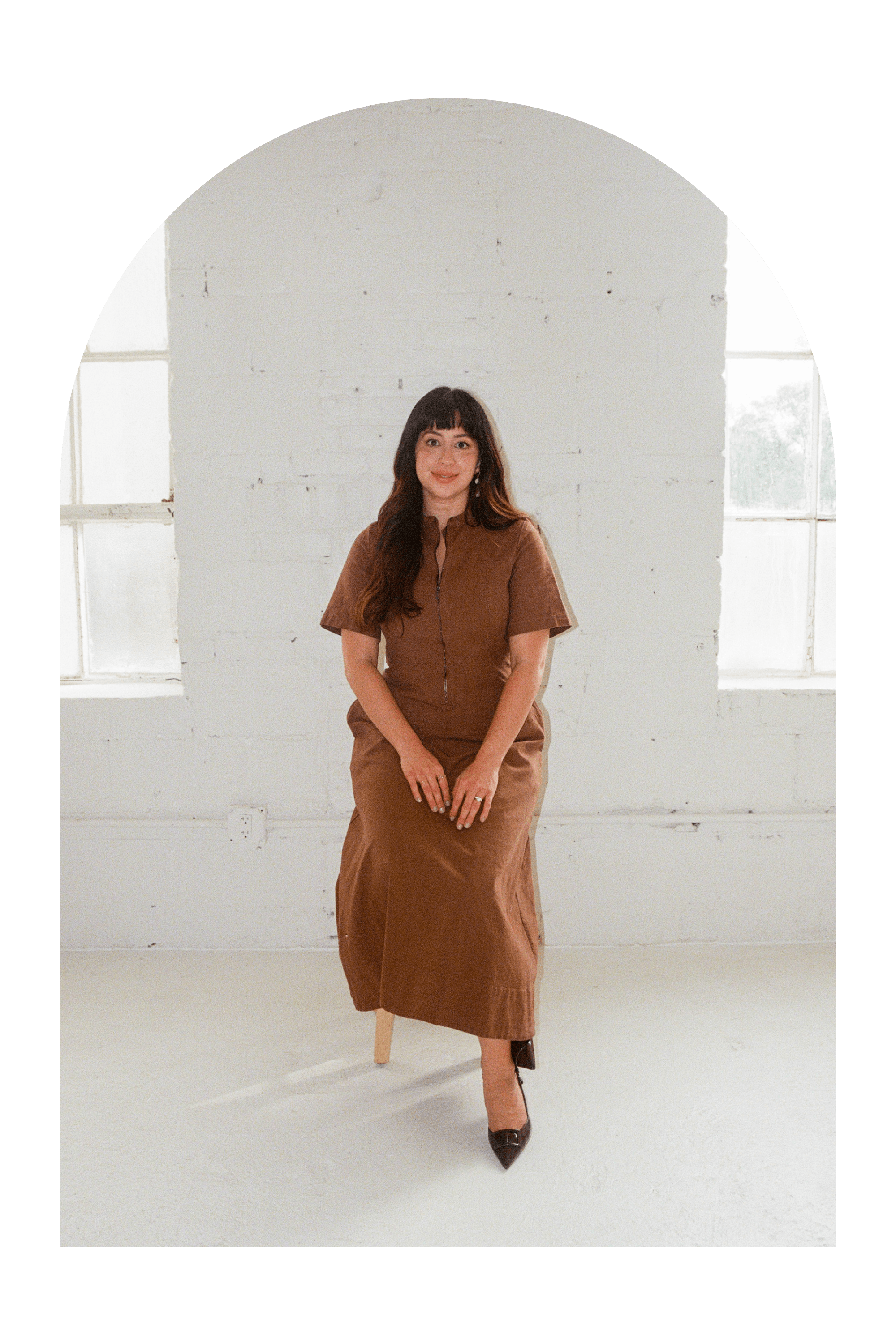 Therapist Amalia Miralrio full body sitting on bench