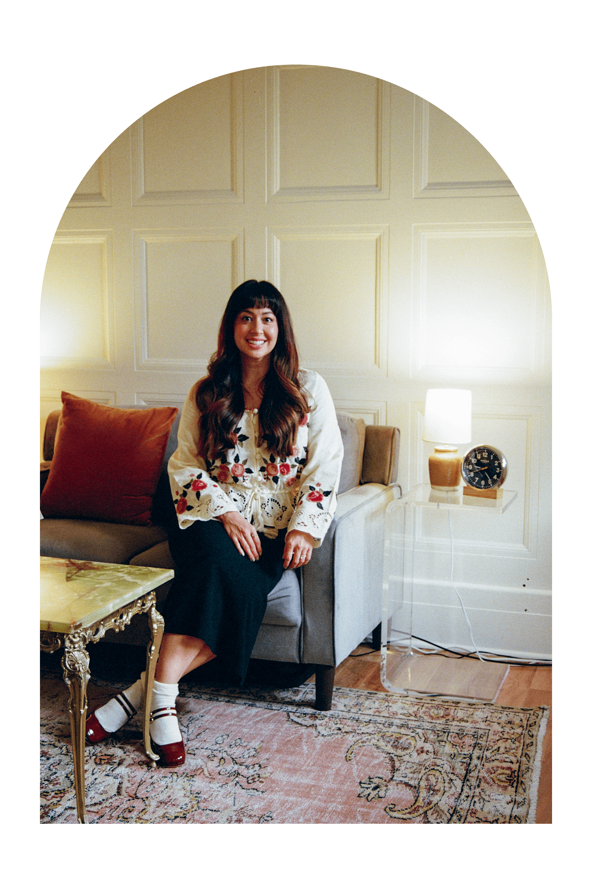 Detroit therapist Amalia Miralrio on couch in office