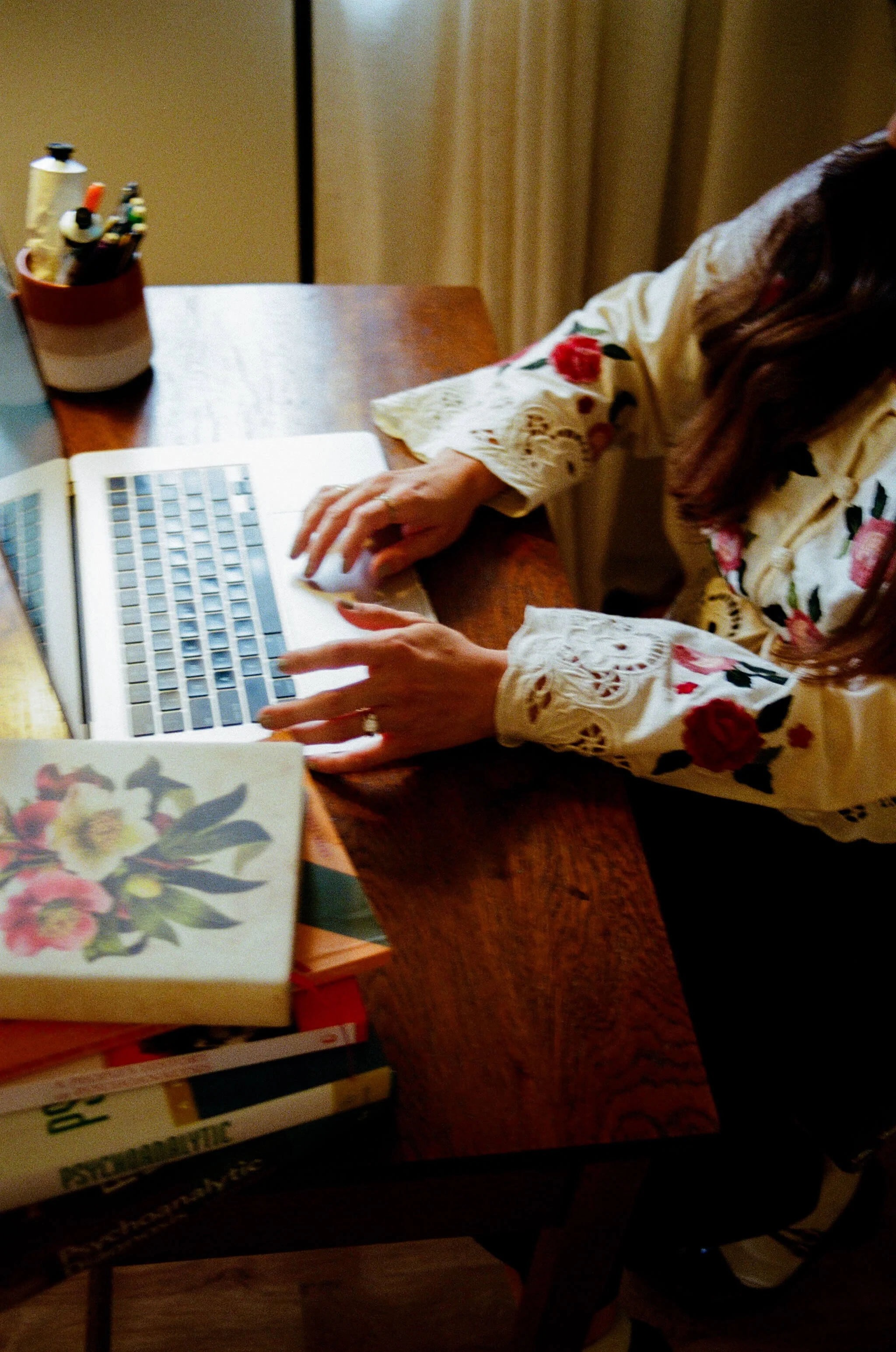 therapist hands typing on laptop