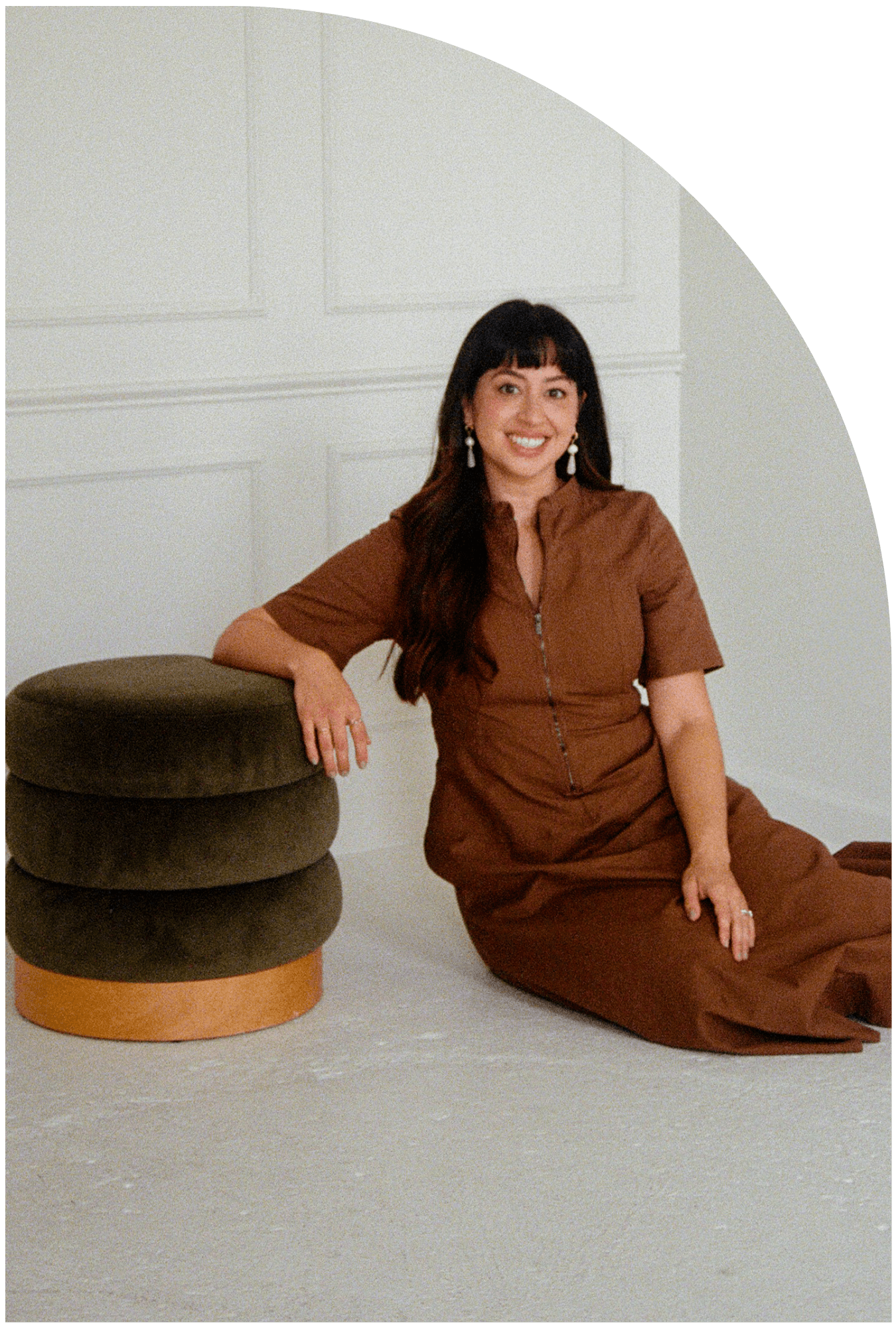 therapist sitting on ground leaning on ottoman