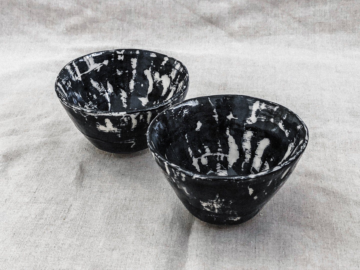 Experimenting and exploring. The marks made by our hands when creating these bowls were not smoothed out, but intentionally left in the clay for visual texture. Painting over them revealed interesting details in our making; where our hands have press