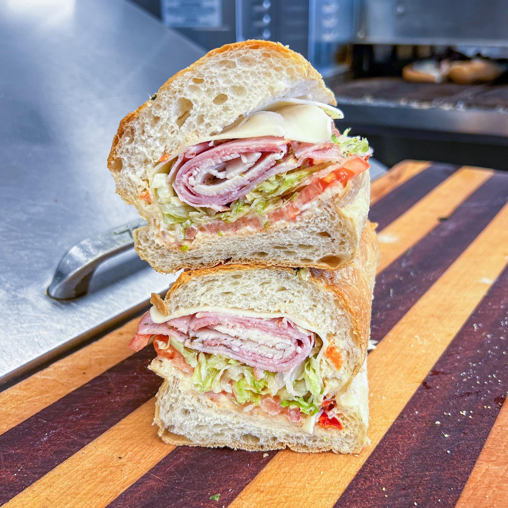 Can't go wrong with a Riccotti's Triple Stack! Comes with a little bit of everything!

We've got oven roasted turkey, smoked ham, genoa salami, provolone choice &amp; your choice of veggies and condiments 🔥🤤

#riccottis #subshop #bestof #sandwich #