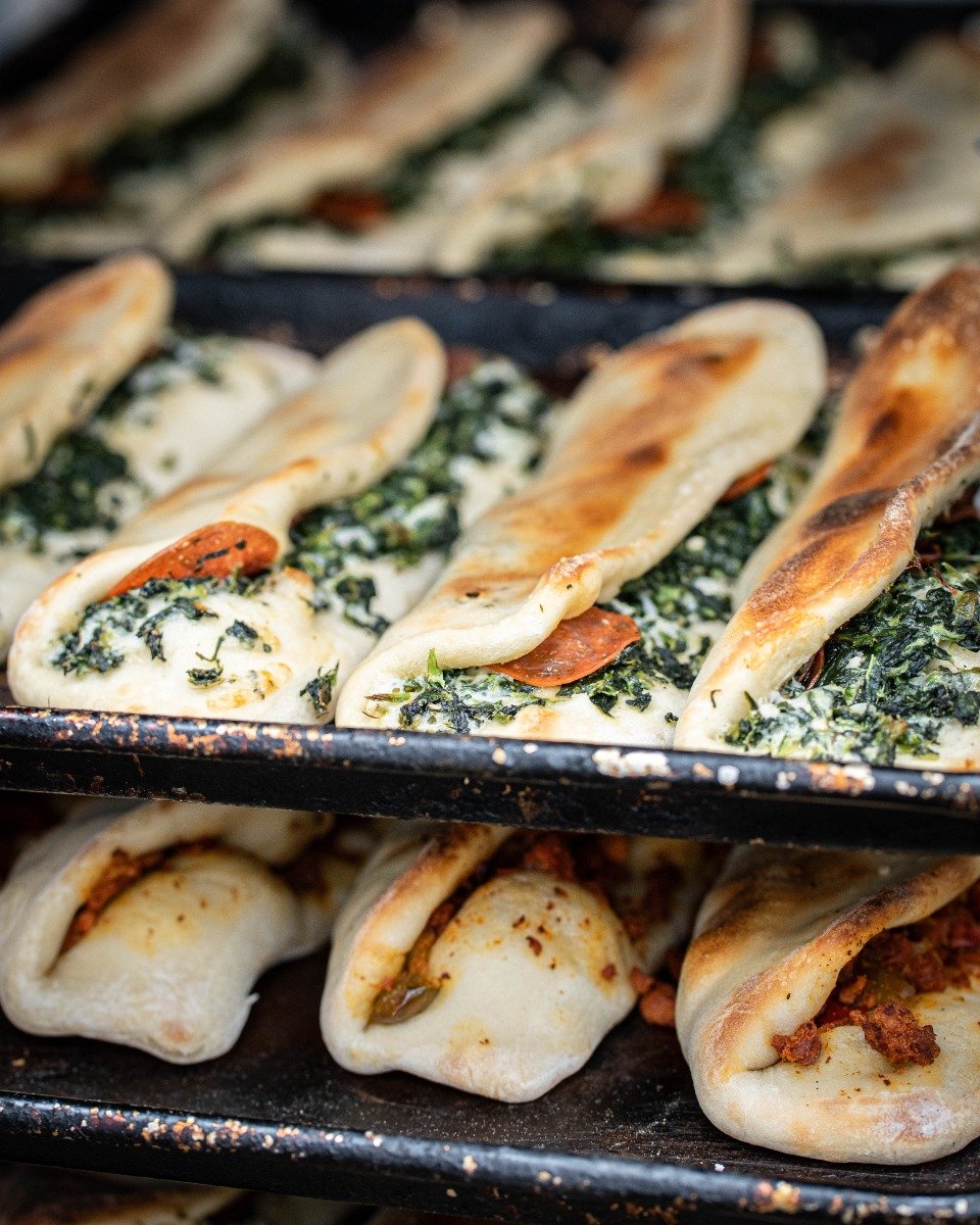 Same recipe. Same love. 5 decades strong 💪 Fresh spinach pies, straight out the oven! 🥬🔥