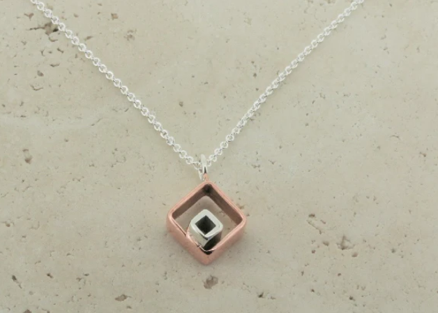 Maker and Providers Silver and Copper Pendant