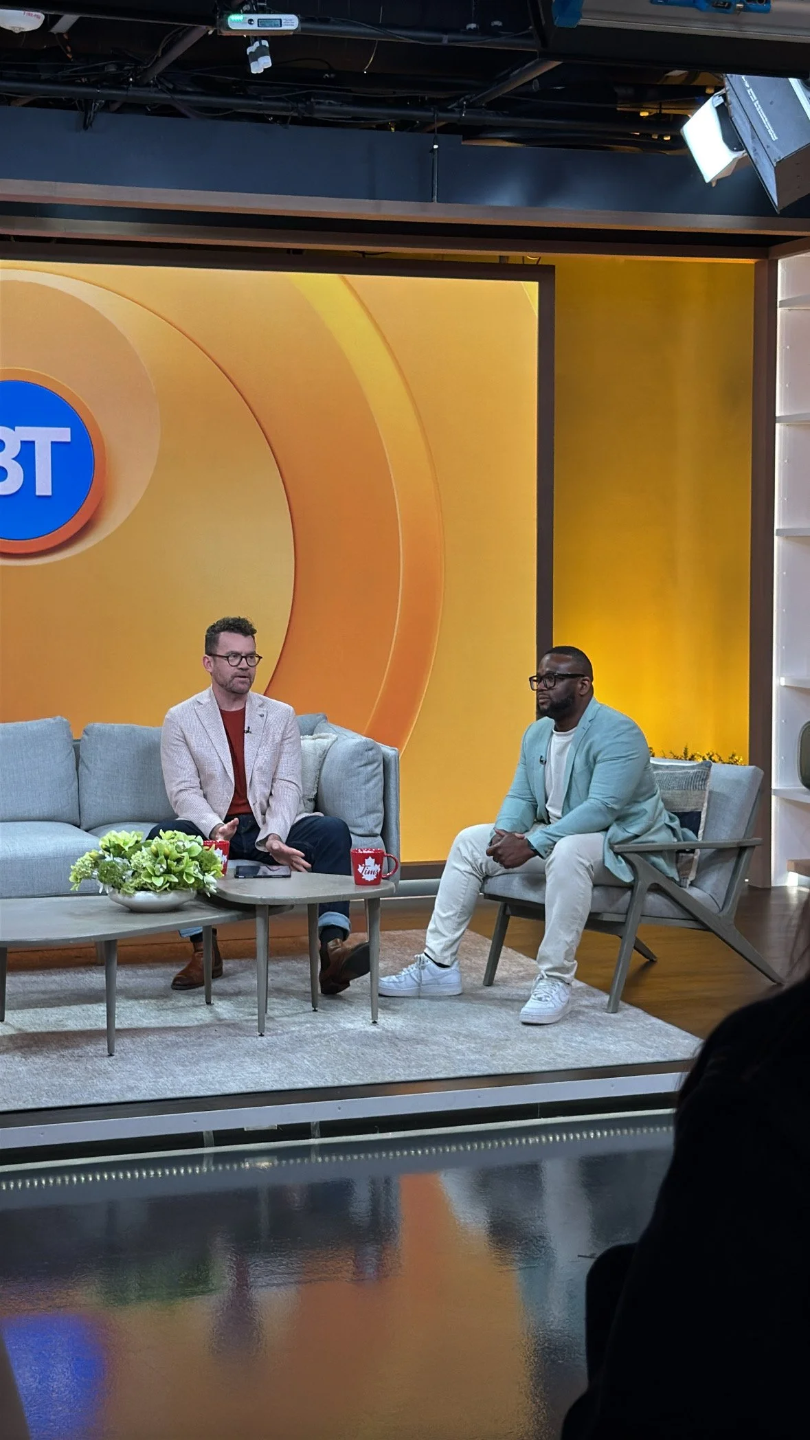 Jermaine Morrison - on the right - talks to Tim Bolen on Breakfast Television about men's loneliness.