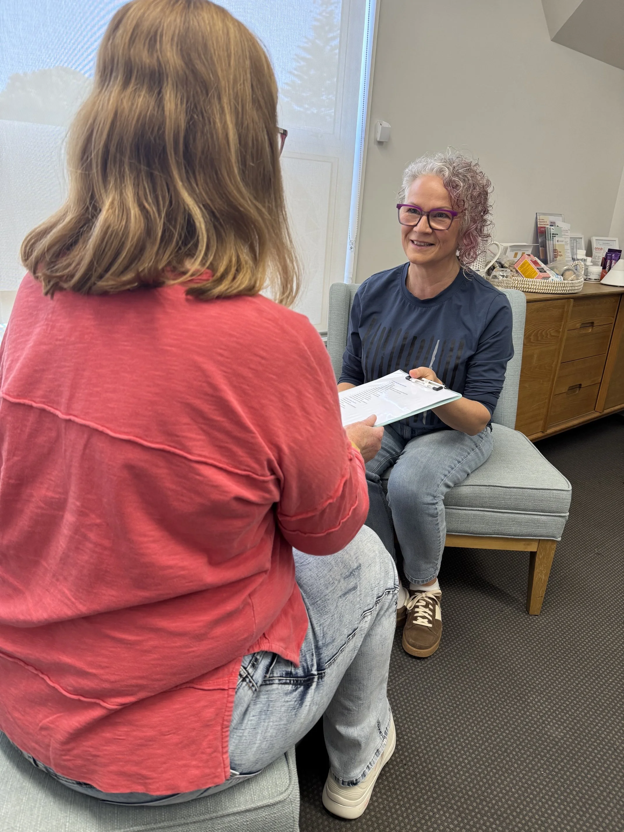A client having a consultation with Andrea