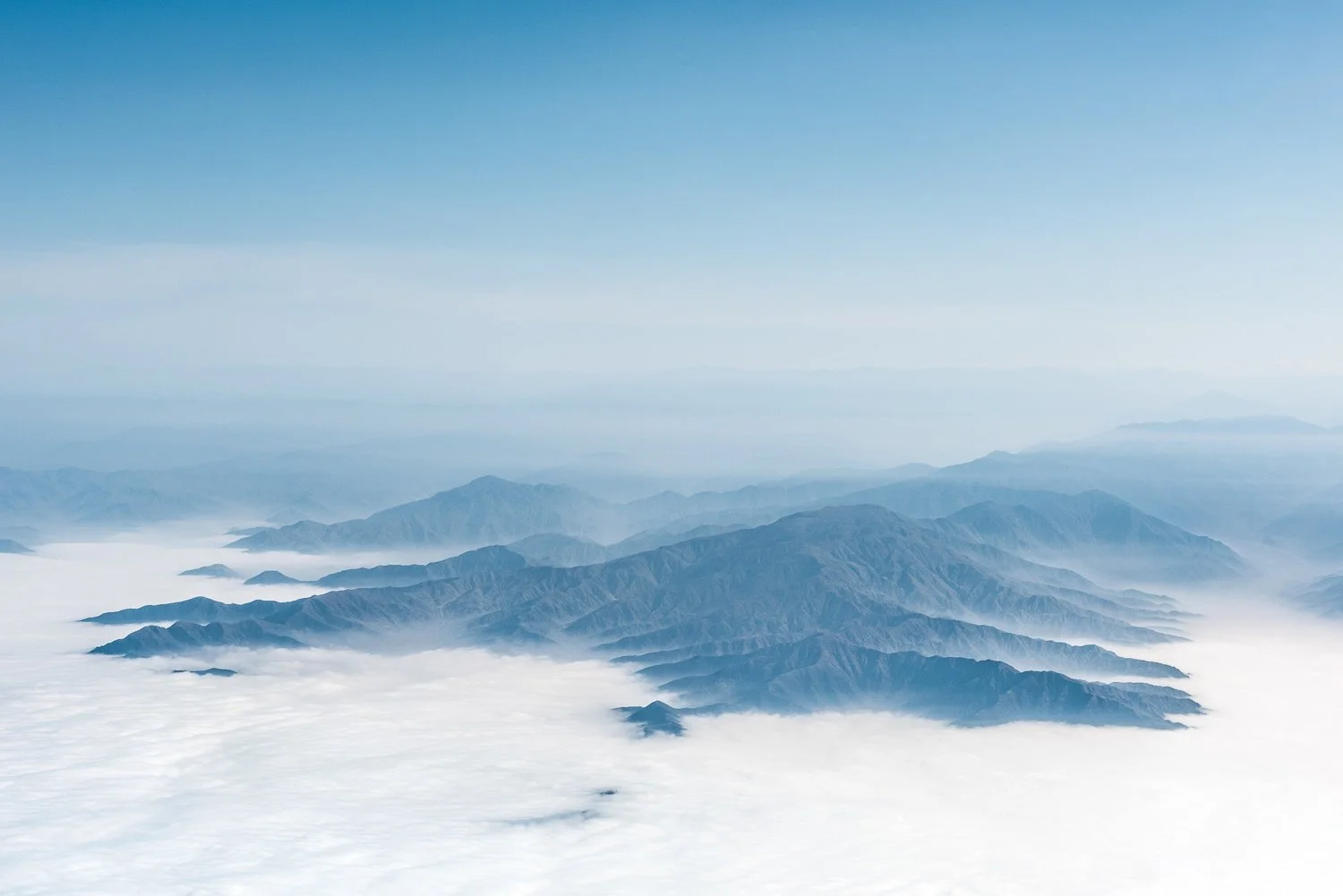 Aerial view of Mountains in Peru surrounded by clouds