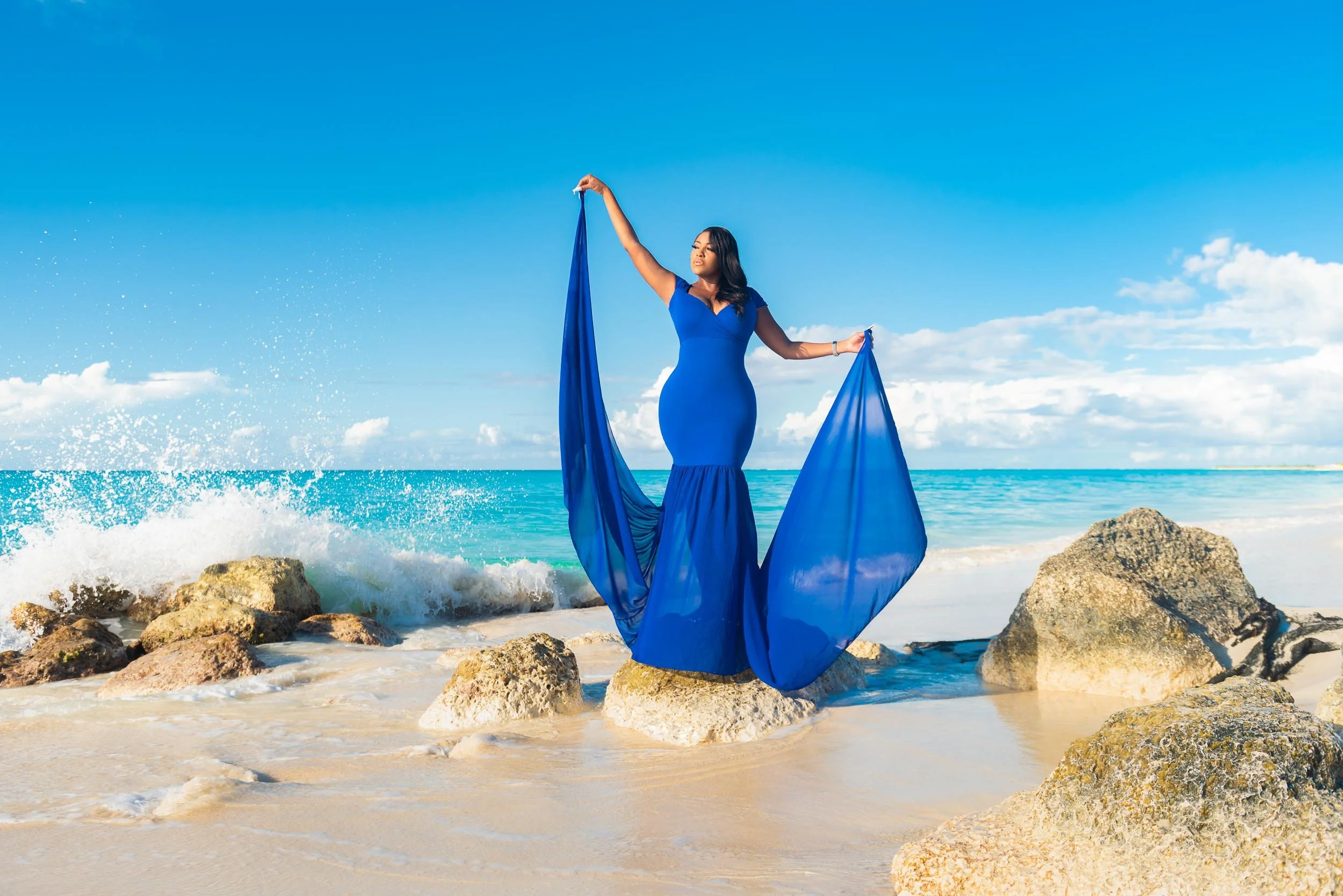 Model on Grace Bay Beach Rocks  - Turks and Caicos What to Do