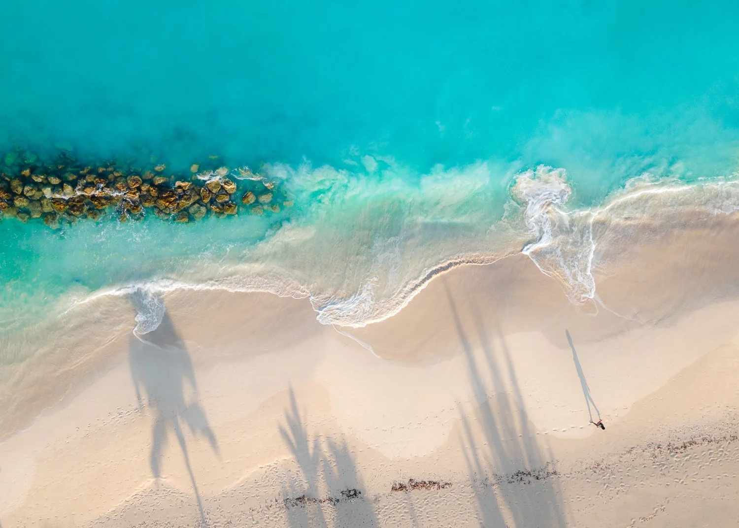 shadows and waves on beach - drone photography how to