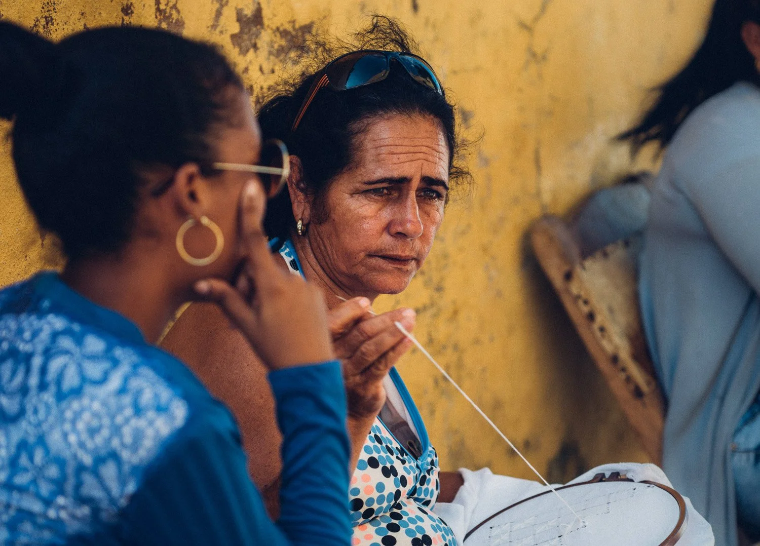 Woman sewing at cuban craft market - visiting Cuba from USA