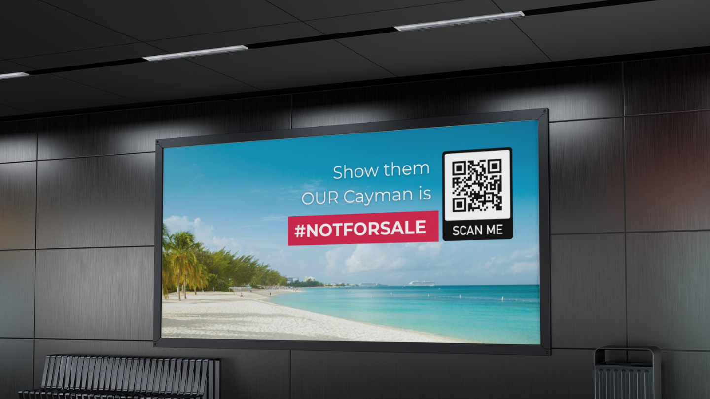 Digital advertisement at an airport showing a beach scene with palm trees and a blue sky. Text says, 'Show them OUR Cayman is #NOTFORSALE' with a QR code and the label 'SCAN ME'.