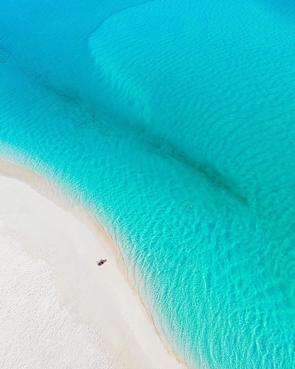 laying on deserted beach - drone photography how to