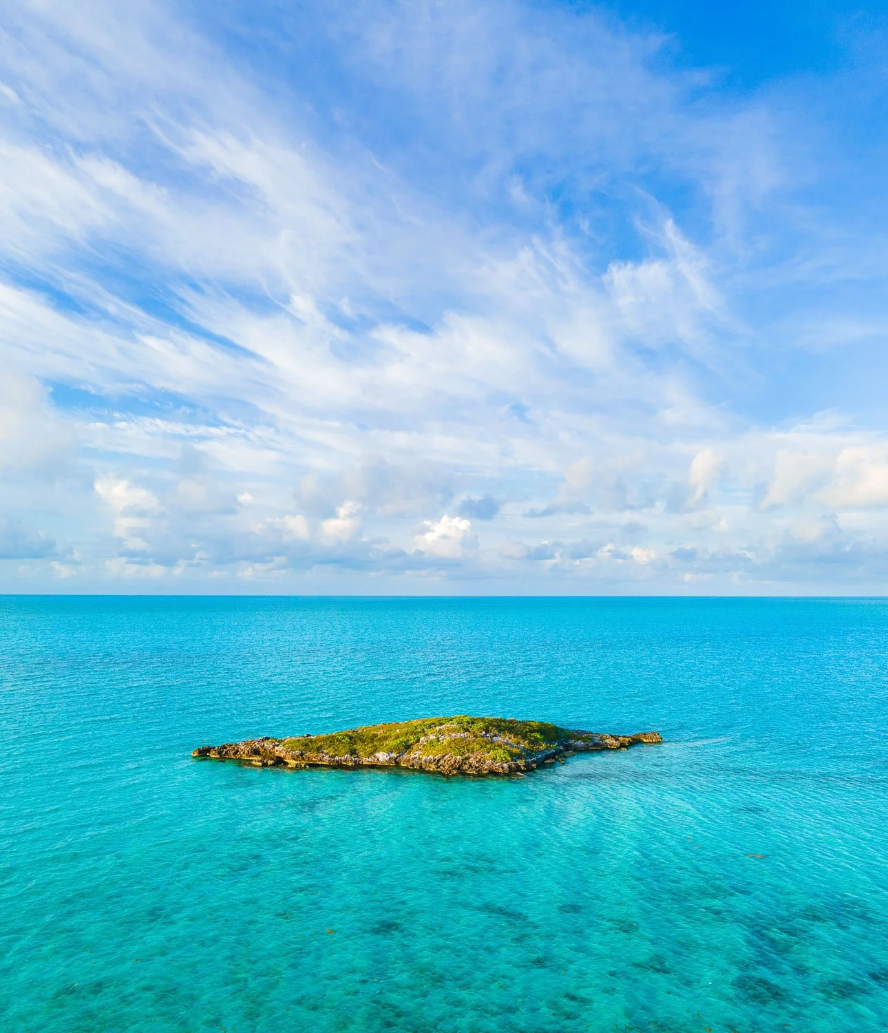 clouds over isolated island - drone photography how to