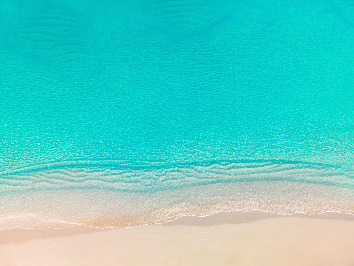 calm waves on tropical beach - drone photography how to