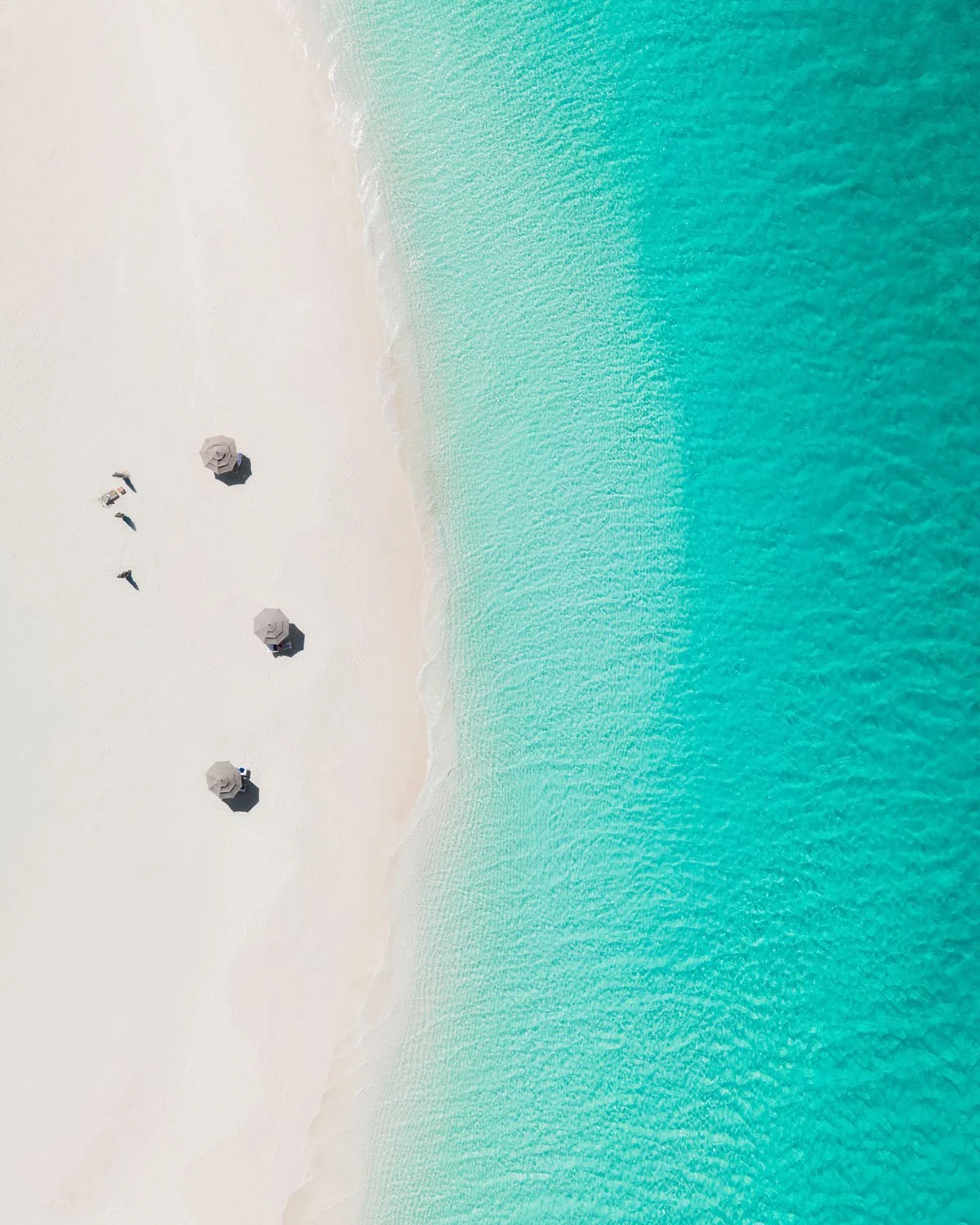 social distancing umbrellas on beach - drone photography how to